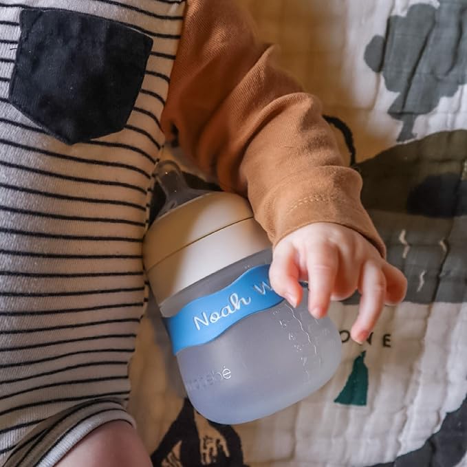 InchBug Orbit Labels - Baby Bottle Name Labels for Daycare, Sippy Cup Bands - Engraved Silicone, Reusable, Dishwasher Safe, White Contrasting Personalization, 4-Pack (Lullaby Blue)