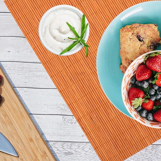 ANDSTAR Non-Slip Waterproof Placemats Set of 6 - Reusable Wipeable Table Mats for Dining Table, Kitchen, Outdoor Picnic, 12x18 Inch PVC Backed Heat Resistant Place Mats Dishwasher Safe（Orange）